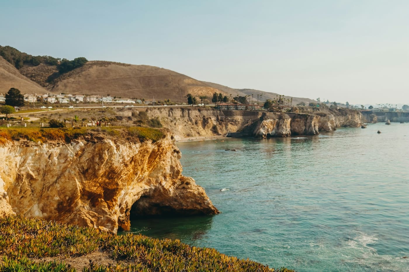 Golden cliffs and a sea arch near San Luis Obispo
